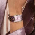 Guess GW0669L2 multicolor watch worn on wrist showing pink dial and purple chainlink bracelet
