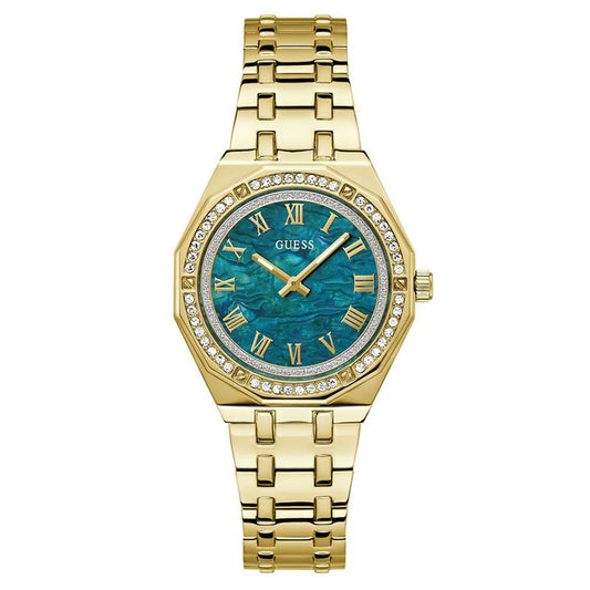 GUESS gold tone analog ladies watch with blue dial, Roman numerals, and crystal-adorned bezel