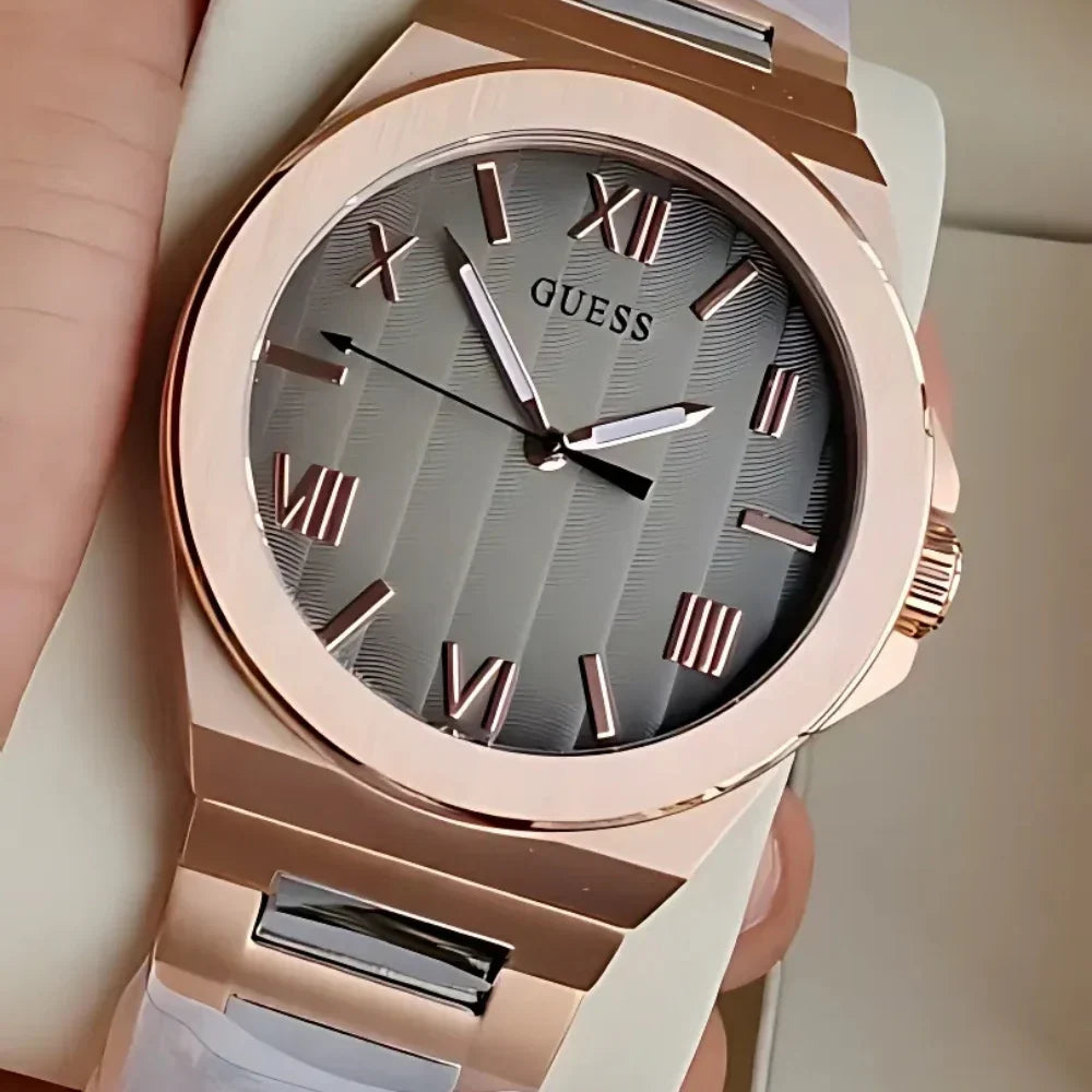 GUESS GW0789G3 rose gold watch on wrist showing grey sunray dial and Roman numeral markers