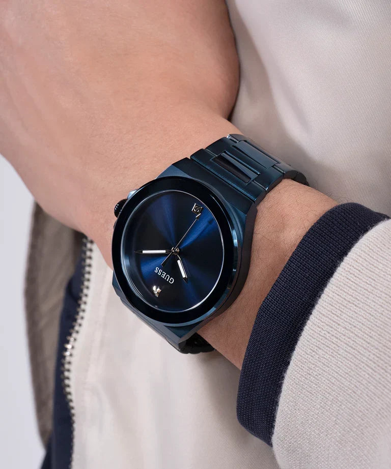 GUESS GW0833G1 blue watch worn on wrist with dark navy dial and blue bracelet