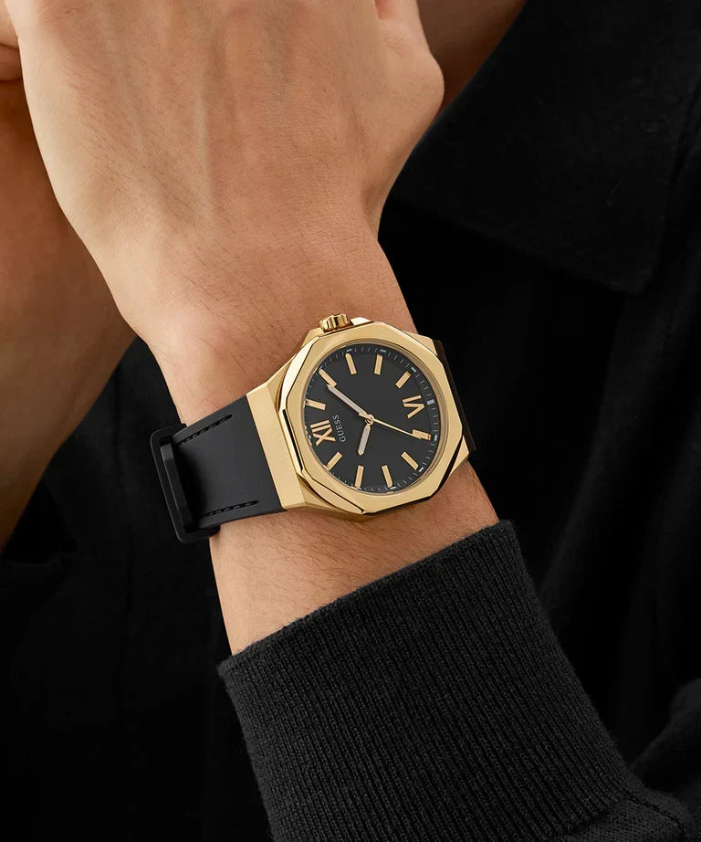 GUESS GW0850G2 black gold-tone watch worn on wrist with black strap