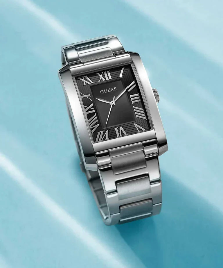 GUESS GW0896G1 silver analog watch worn on wrist with white shirt